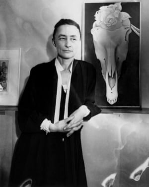 Georgia O’Keeffe in 1931 with her painting Horse Skull with White Rose.