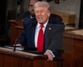 Donald Trump speaks at a lectern.
