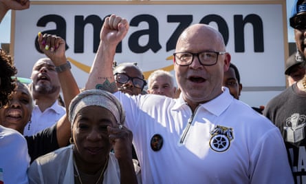 The Teamsters president, Sean O’Brien, center, rallies with Amazon workers outside the Staten Island Amazon facility JFK8, 19 June, in New York.