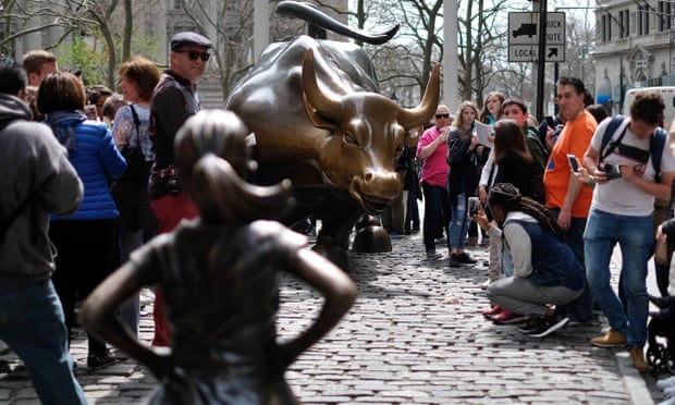  The Fearless Girl statue briefly had a new animal rival before the artist removed Pissing Pug. Photograph: Jewel Samad/AFP/Getty Images  