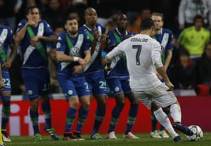 Cristiano Ronaldo takes the free-kick.