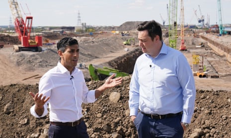 Rishi Sunak (left) speaks with Tees Valley Mayor, Ben Houchen, during a visit to Teesside Freeport, Teesworks, in Redcar, Teeside.