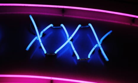 A neon sign advertising a sex shop