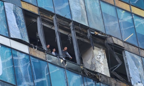 Investigators at a damaged office building in Moscow City after a reported Ukrainian drone strike on 1 August