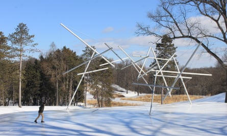 collection of poles, joined by cables, pointing in various directions on the snow