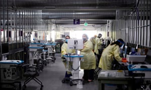 Respiratory therapists and nurses work in the Covid-19 alternative care site, built into a parking garage, at Renown Regional Medical Center in Reno, Nevada, on Wednesday.