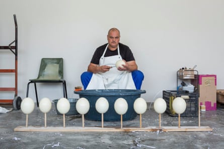 An employee empties ostrich eggs in the factory of the agricultural cooperative Klein Karoo. He manages the egg workshops of the factory which produces decorative eggs. The ostrich egg weighs between 1.2 and 1.8kg and is the largest in the animal kingdom.