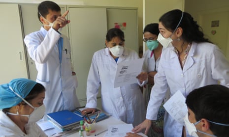 Dr Ana P Cavalheiro with an MSF team at Machiton Hospital in Tajikistan as a local Nurse explains how to use the new TB medication Dlm 