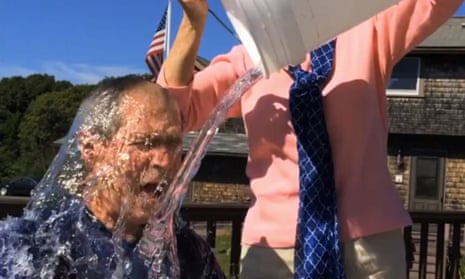 In this image from video posted on Facebook, George W. Bush participates in the ice bucket challenge with the help of his wife, Laura Bush.
