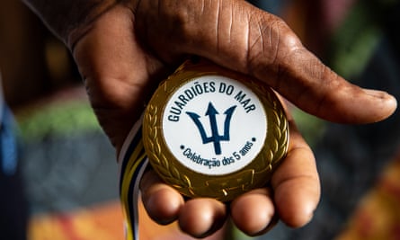 Boaventura Martins, a fisherman on Maio in Cape Verde, holds his Guardians of the Sea medal.