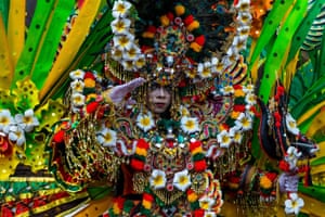 People parade in colourful costumes at the Malang flower festival