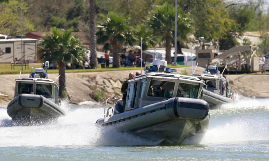 US Customs and Border Protection boats carrying the speaker of the House, Paul Ryan, and other legislators travel the Rio Grande in Texas on Wednesday.