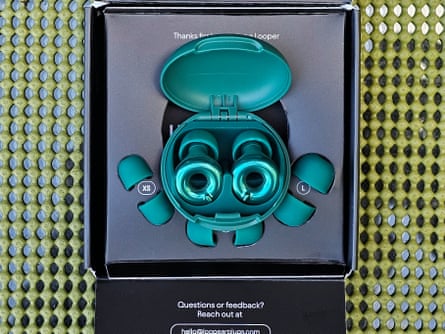 teal-colored Loop Switch 2 earplugs inside of obx
