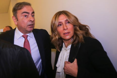 Former Renault-Nissan boss Carlos Ghosn (C) arrives with his wife Carole today