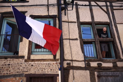 A French flag and a Tour de France fan.
