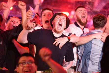 England fans celebrate their first goal in the match against Mexico