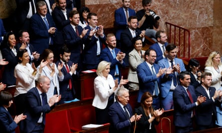 Marine Le Pen (centre) and MPs of the National Rally giving a standing ovation at the National Assembly in Paris on June 3, 2024