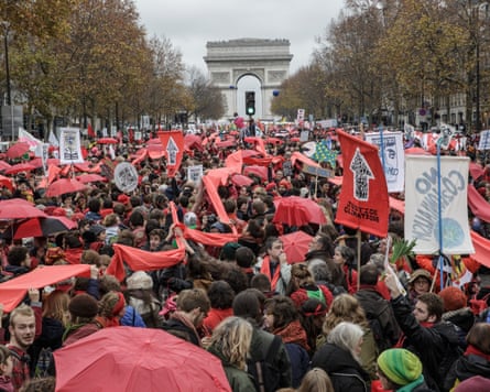 Thousands of activists gather during a demonstration near the Arc de Triomphe in Paris on 12 December 2015.