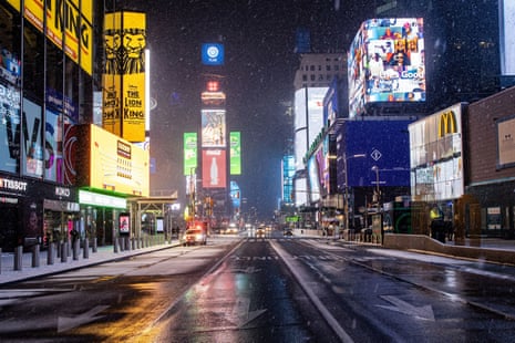 An empty street is seen as snow begins to fall in Times Square during a snow storm, during the coronavirus disease in January 2021. 