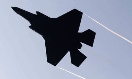 An Israeli F-35 fighter jet silhouetted against the sky as it takes off