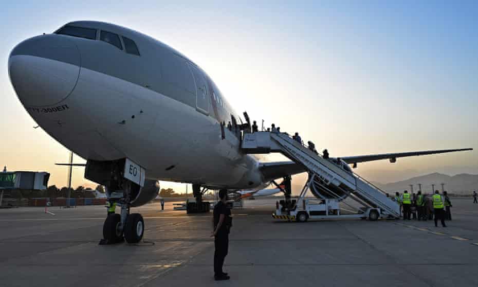 People board a passenger jet