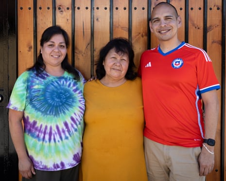 Sean and Emily with their birth mother, Sara, outside her house in Santiago, Chile