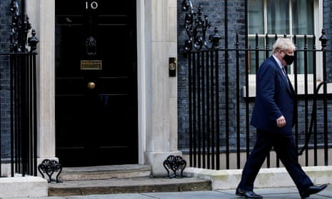 British prime minister Boris Johnson walks outside Downing Street in London.