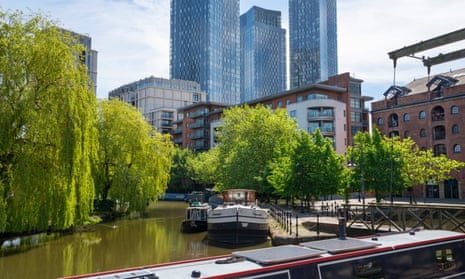Castlefield Basin, Manchester, England. Area around the Wharf on the Bridgewater canal with apartment blocks behind.