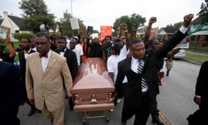 A demonstration led by activist Quanell X (right) in 2013, in Houston, over the death of Trayvon Martin.