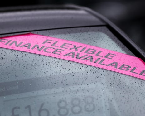 A vehicle is displayed for sale at car dealership