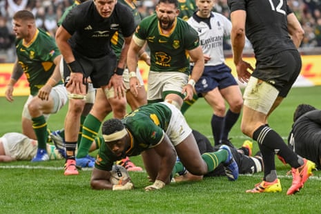 South Africa's flanker Siya Kolisi (bottom) grounds the ball to score his side’s third try.