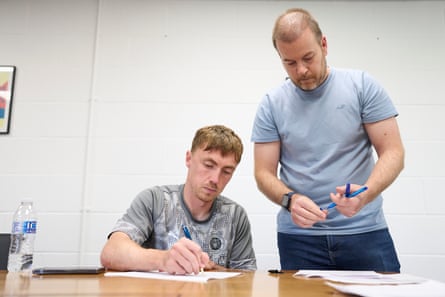 Ben Osborn signing his indebtedness statement astatine nan club