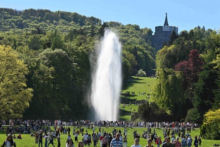 Visitors watch the water features in Bergpark Wilhelmshohe Kassel, Germany