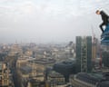 High stakes pursuit: an urban explorer atop the Lloyd’s building in London.