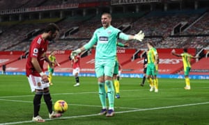 West Bromwich Albion goalkeeper Sam Johnstone (centre) reacts after saving Manchester United’s Bruno Fernandes’ penalty before it is ordered to be retaken.