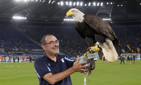 Maurizio Sarri celebrates with Olimpia the eagle, Lazio's mascot, after the 3-2 derby defeat of Roma.