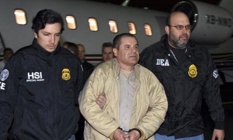 Authorities escort Joaquin ‘El Chapo’ Guzman from a plane at MacArthur airport in New York state. 