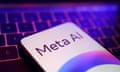 a meta AI logo on a smartphone next to a keyboard