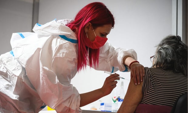 A Serbian medical worker administers a dose of the Oxford-AstraZeneca vaccine in Belgrade.