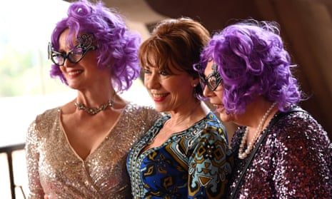 Author Kathy Lette (centre) and two women dressed as Dame Ednaon arrive at the State Memorial Service for Australian comedian and actor Barry Humphries at the Sydney Opera House in Sydney, Australia, 15 December 2023.