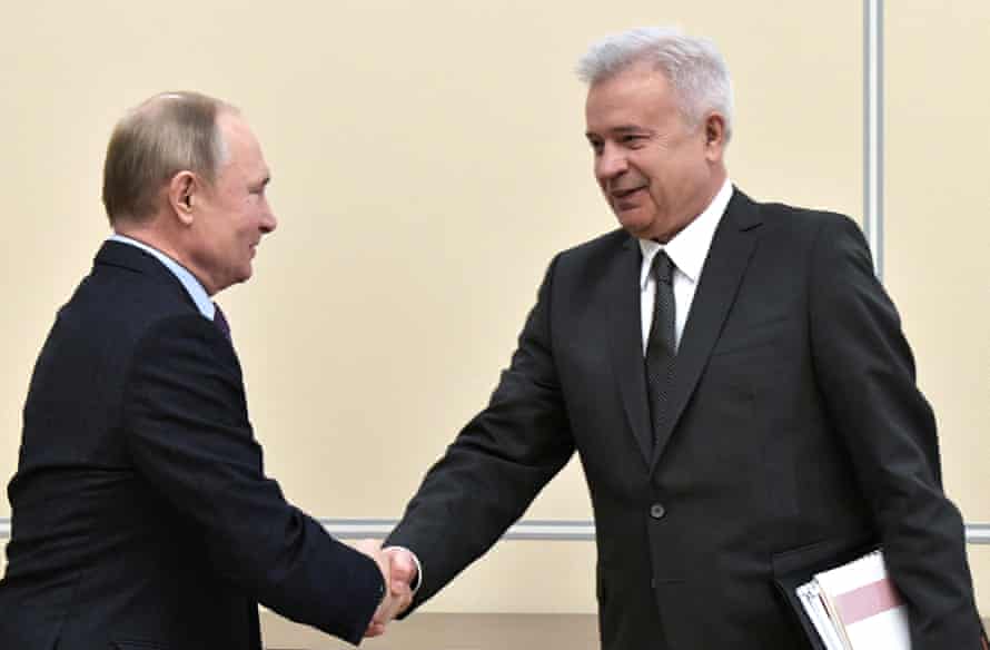 The Russian president, Vladimir Putin, left, shakes hands with the main enforcement of Lukoil, Vagit Alekperov, during a gathering successful Moscow past year.