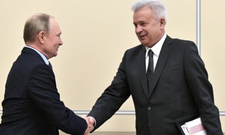 President Vladimir Putin shakes hands with Vagit Alekperov, the president of Lukoil, in Moscow.