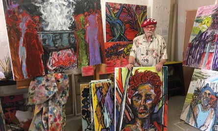 Roger Phillips in his studio with a selection of his paintings.