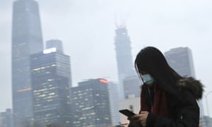 Woman wearing a mask.