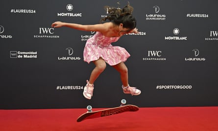Australian skateboarder Arisa Trew performing a kick flip on a skateboard on the red carpet of the Laureus World Sports Awards in Madrid.