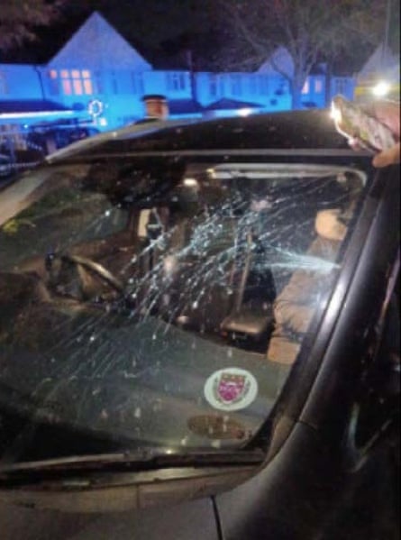 Black car with shattered windscreen