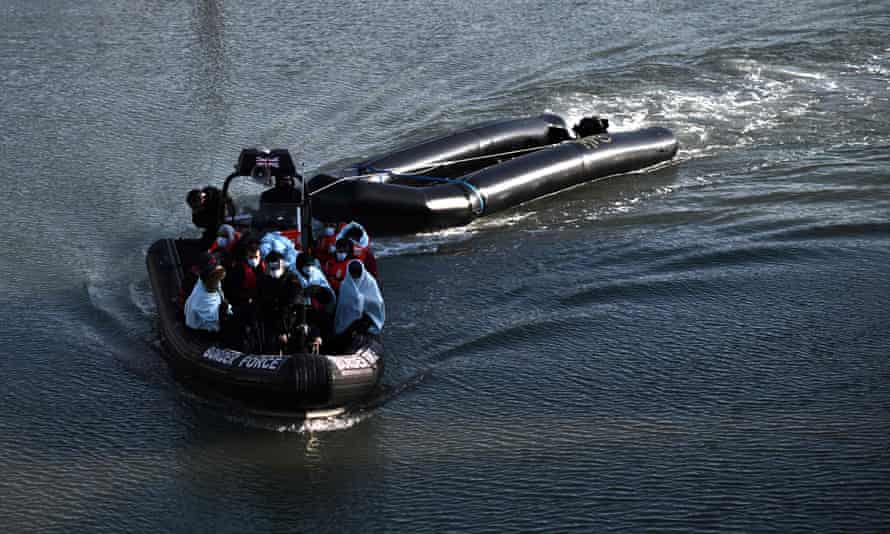 Migrants are taken to Dover on a UK Border Force boat after attempting to cross the Channel last week.