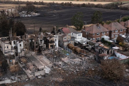 The charred shells of burnt out homes seen from the air.