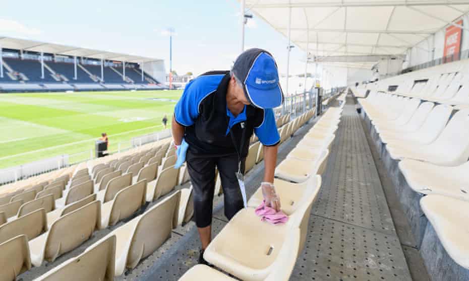A cleaner cleans seats prior to the round two Super Rugby Aotearoa match between the Crusaders and the Hurricanes at Orangetheory Stadium,