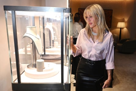 Ellie Goulding stands by a case displaying diamond jewellery in the Boodles store.